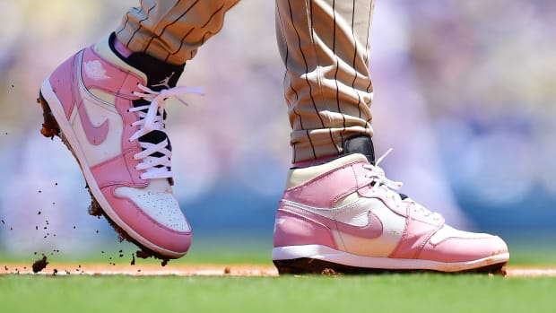 Pink and white Air Jordan cleats worn by Fernando Tatis Jr.
